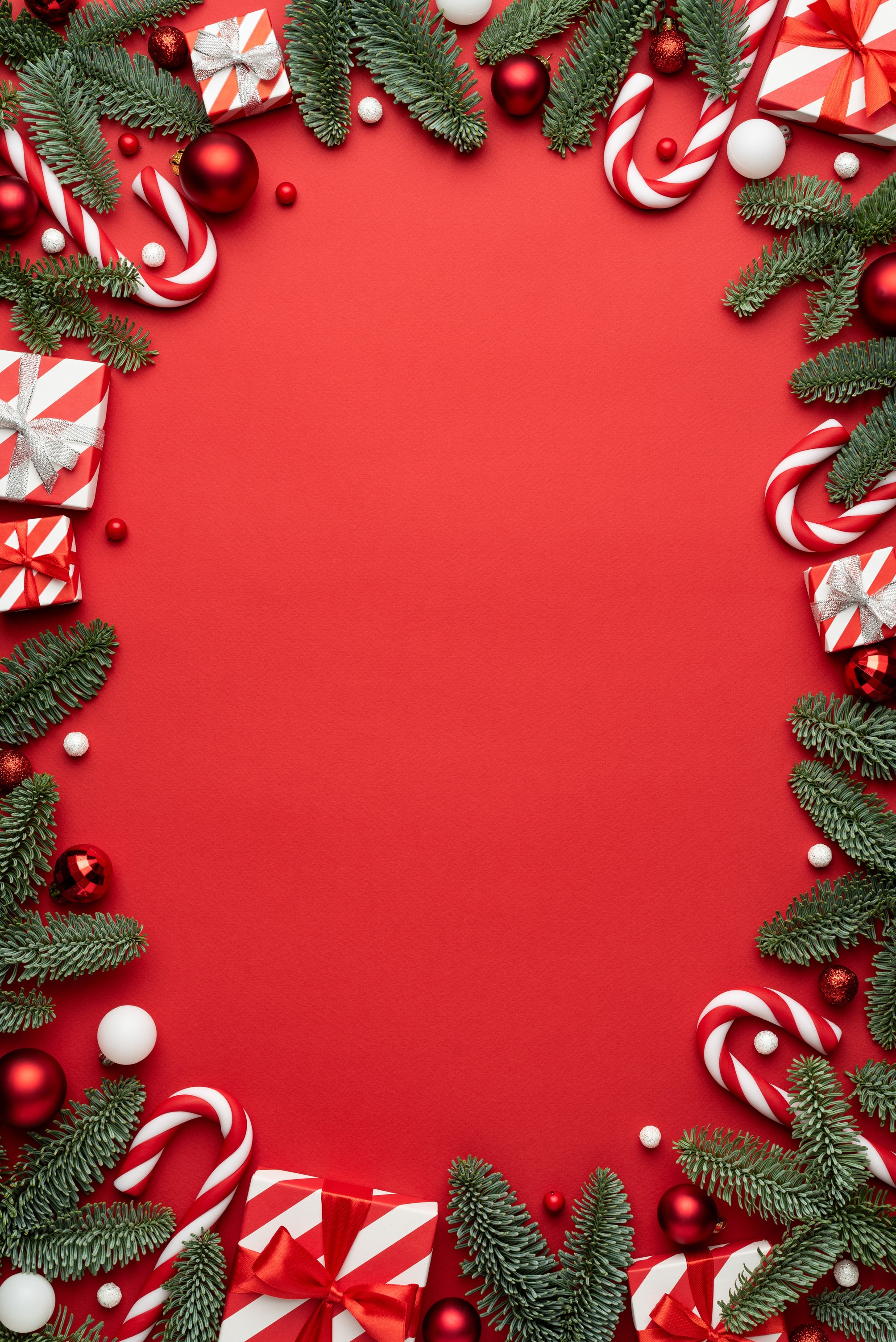 Red Background with Christmas Baubles and Decorations 